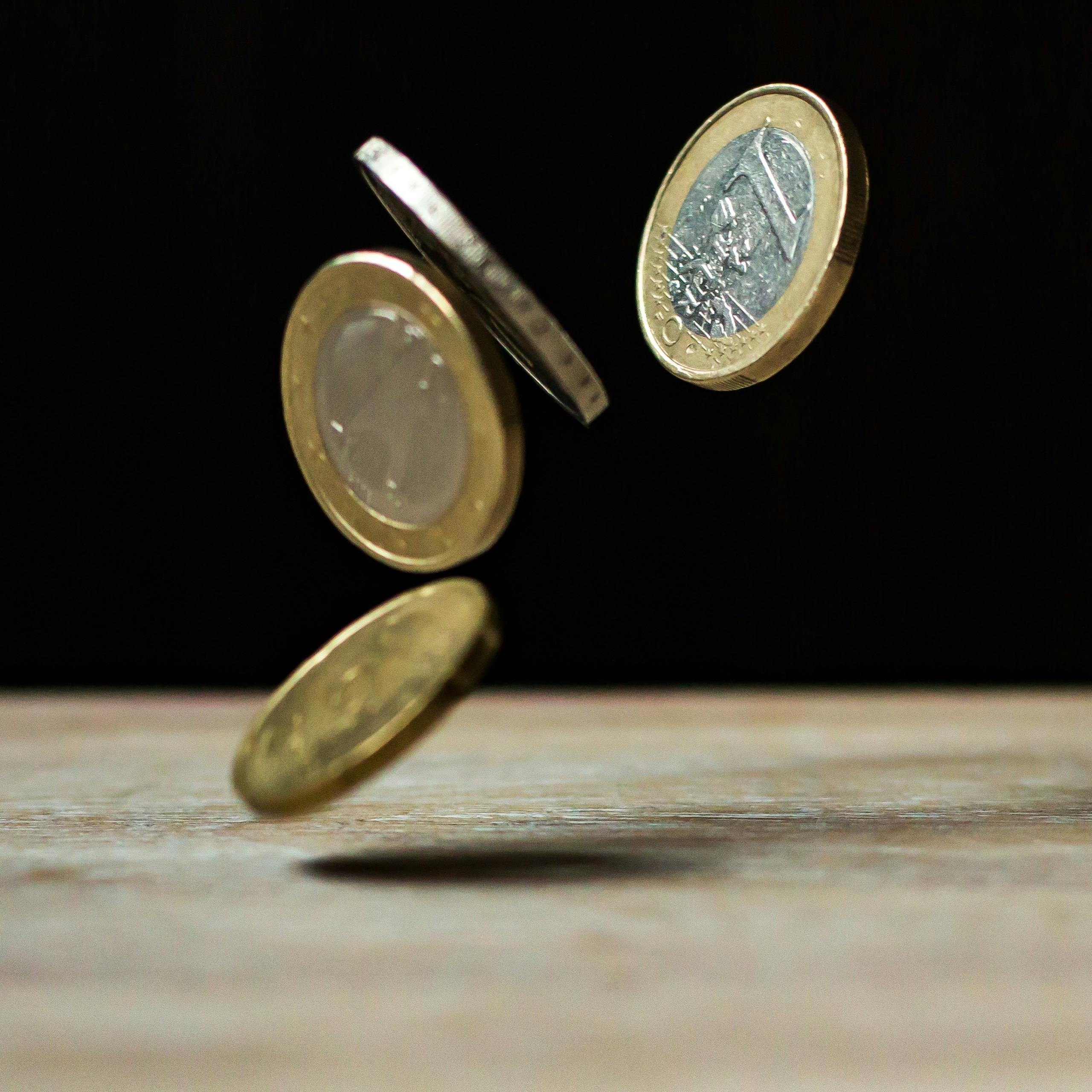 Coins on Brown Wood