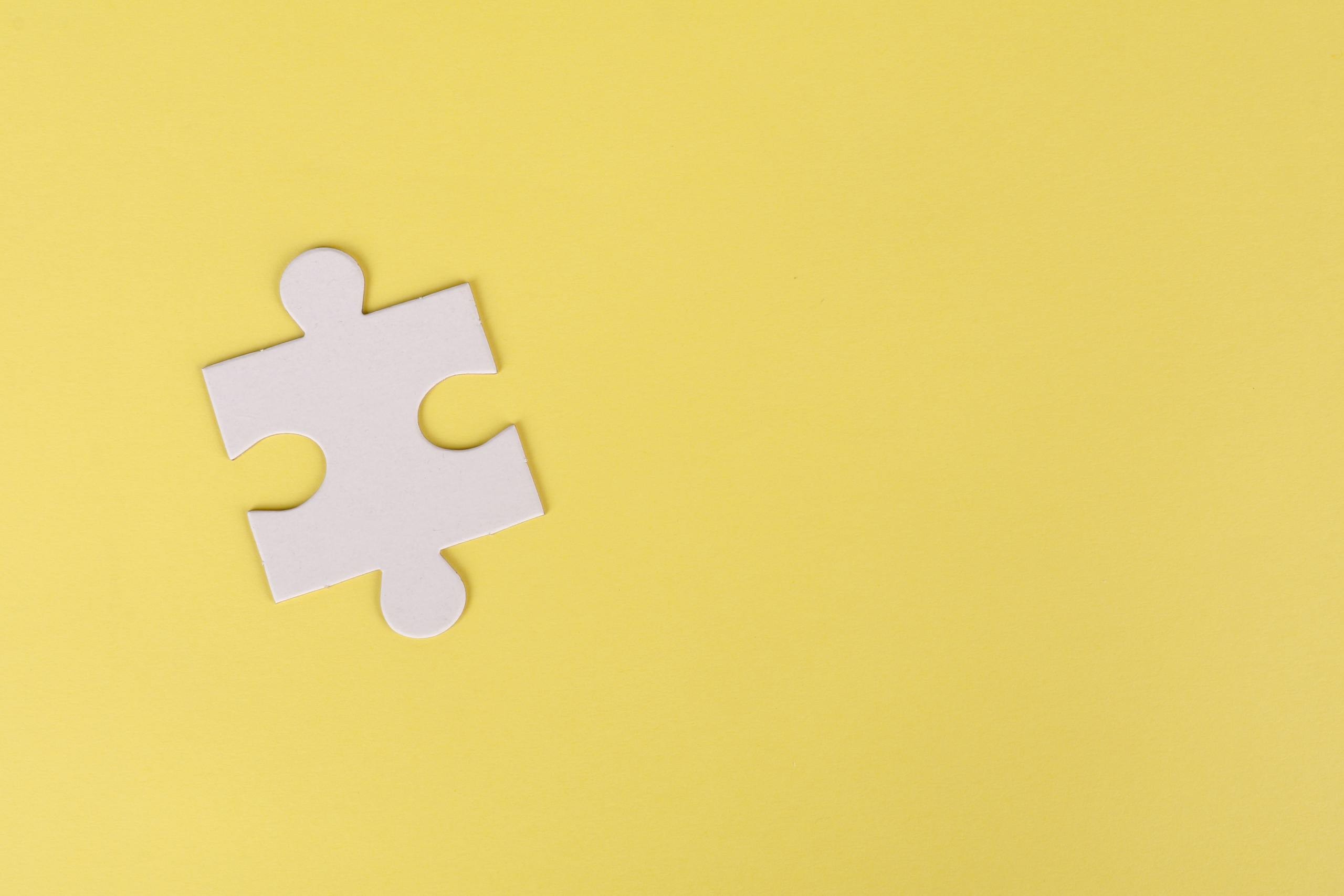 Jigsaw Puzzle on Yellow Background